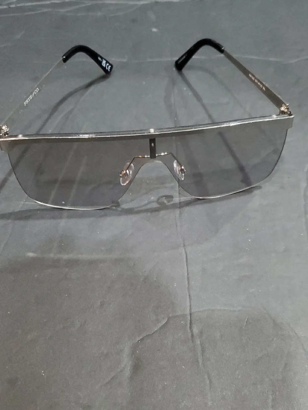 Frye silver flatbrow rimless frame oversized clear lenses square sunglasses
